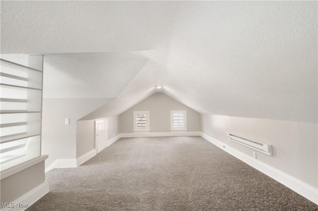 bonus room with a textured ceiling, vaulted ceiling, carpet, and a baseboard radiator