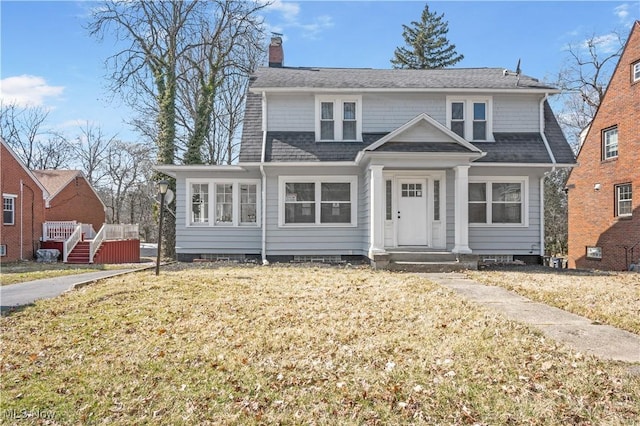 bungalow-style home with crawl space, a chimney, and a shingled roof