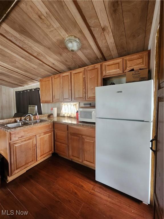 17875 Lashley Rd, Senecaville, OH 43780 - kitchen featuring dark wood finished floors, wooden ceiling, a peninsula, white appliances, and a sink