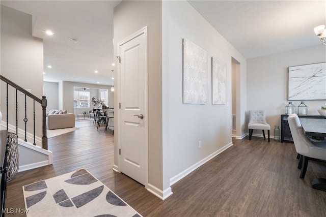 interior space with recessed lighting, baseboards, and wood finished floors