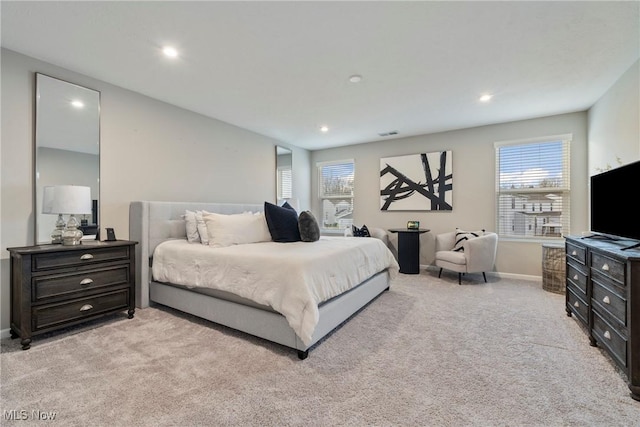 bedroom with recessed lighting, baseboards, and light carpet