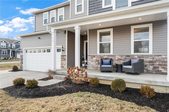 exterior space featuring stone siding, covered porch, and driveway