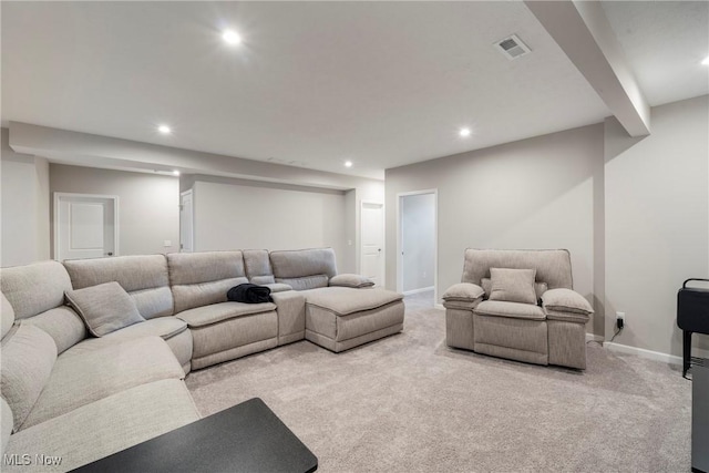 carpeted living room featuring recessed lighting, visible vents, and baseboards