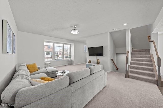 living room featuring stairway, baseboards, and carpet