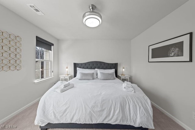 bedroom with carpet flooring, baseboards, and visible vents