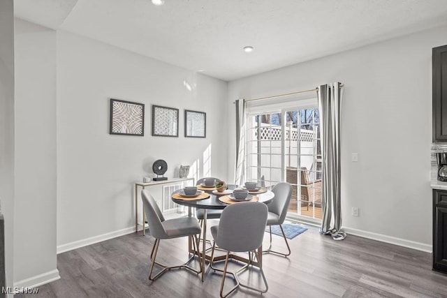 dining room featuring recessed lighting, baseboards, and dark wood-style flooring