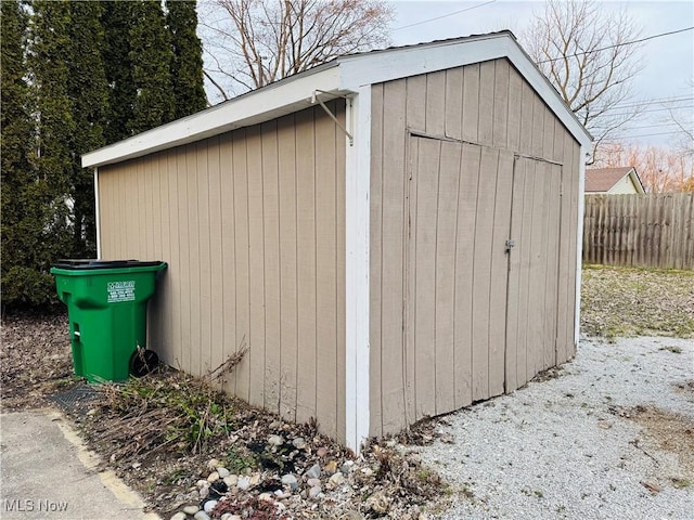 view of shed with fence