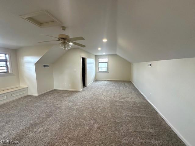 1119 Abbey Pl, Zanesville, OH 43701 - bonus room featuring visible vents, baseboards, lofted ceiling, and carpet flooring