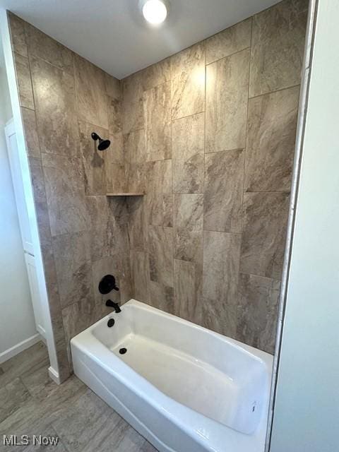 1119 Abbey Pl, Zanesville, OH 43701 - bathroom featuring  shower combination and baseboards