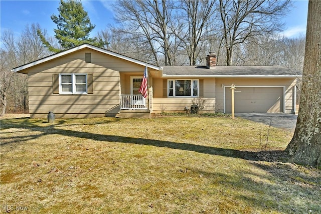 ranch-style house featuring driveway, a front lawn, an attached garage, and a chimney