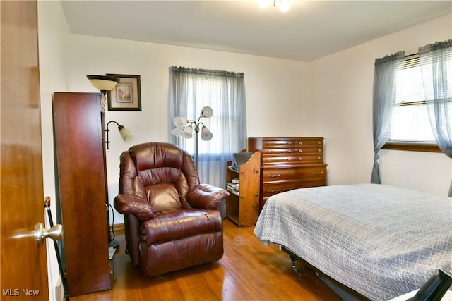 bedroom featuring wood finished floors