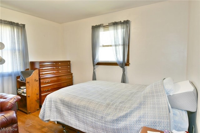 bedroom featuring wood finished floors