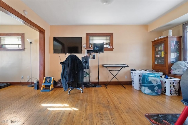 interior space featuring hardwood / wood-style flooring and baseboards