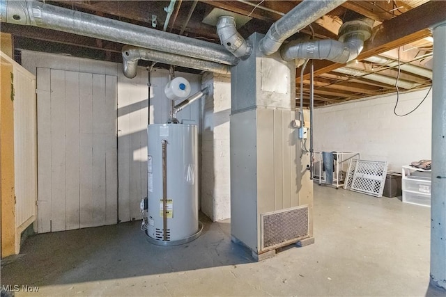 unfinished basement featuring heating unit and gas water heater