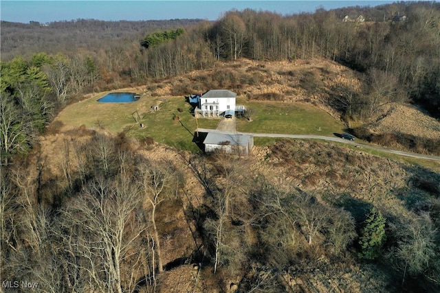 aerial view with a wooded view