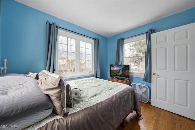 bedroom with wood finished floors