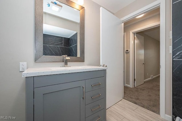 bathroom with baseboards and vanity