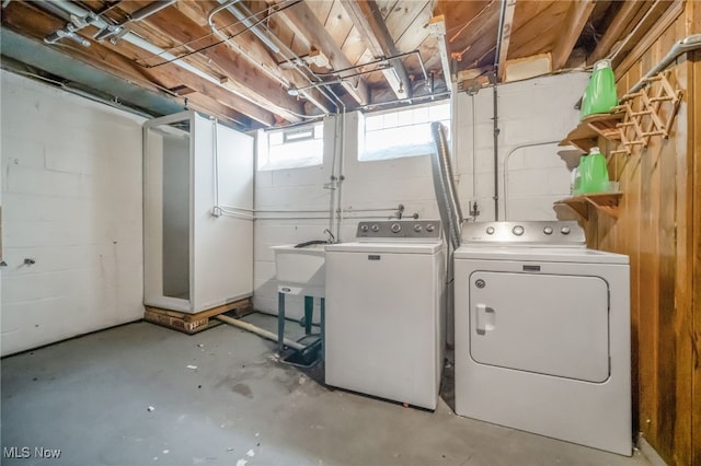 laundry area with separate washer and dryer and laundry area