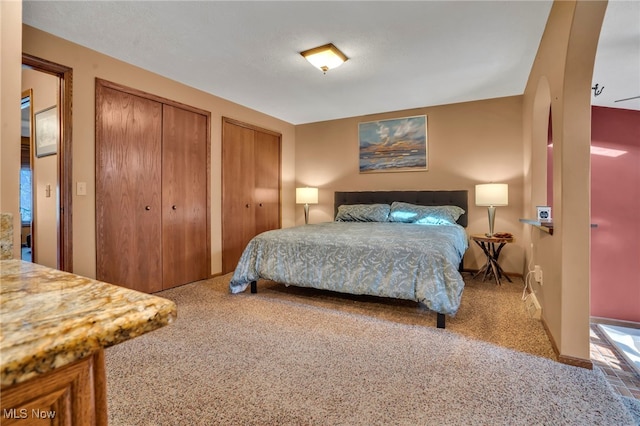 1580 Salway Ave SW, North Canton, OH 44709 - carpeted bedroom featuring baseboards and multiple closets