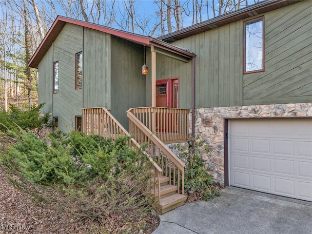 1580 Salway Ave SW, North Canton, OH 44709 - view of front facade with stone siding and an attached garage