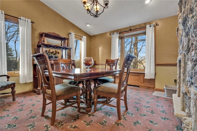 1580 Salway Ave SW, North Canton, OH 44709 - dining space featuring a healthy amount of sunlight, carpet flooring, and vaulted ceiling