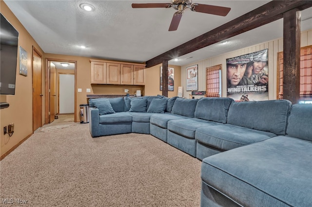 1580 Salway Ave SW, North Canton, OH 44709 - living area with a textured ceiling, beam ceiling, light carpet, and ceiling fan