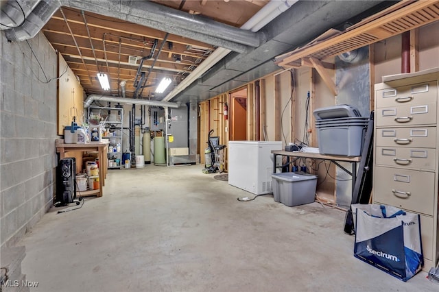 1580 Salway Ave SW, North Canton, OH 44709 - unfinished basement featuring fridge, heating unit, and concrete block wall