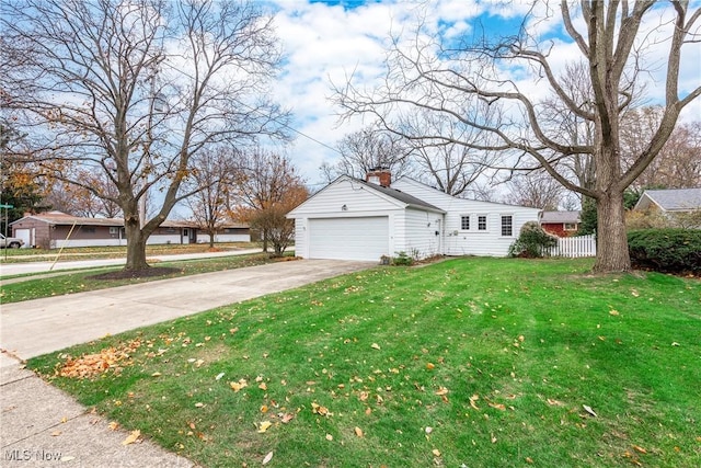 view of front of property with a chimney, concrete driveway, a front yard, and fence