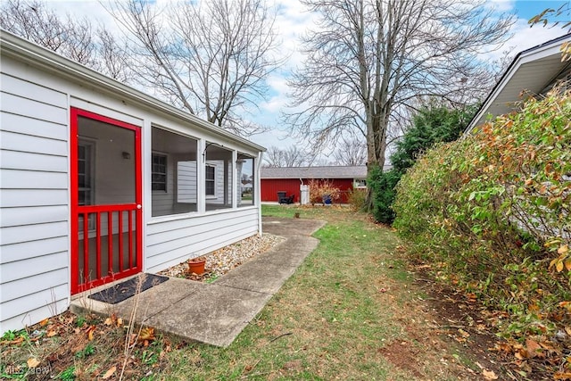 view of yard featuring a sunroom