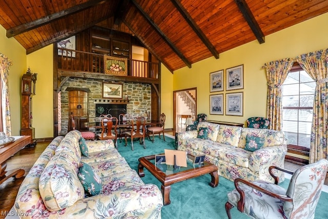 living area with stairs, wooden ceiling, beamed ceiling, and high vaulted ceiling