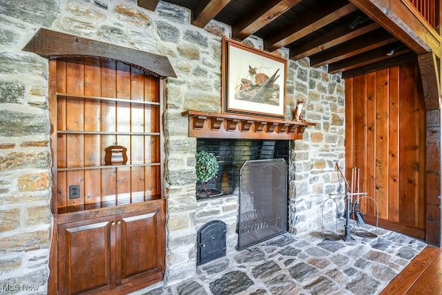 room details featuring a stone fireplace