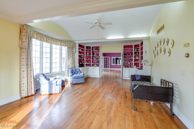 sitting room featuring baseboards, wood finished floors, visible vents, and ceiling fan