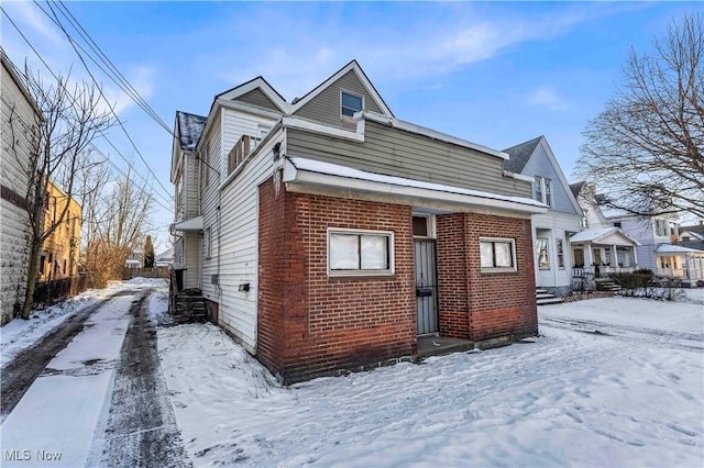 exterior space featuring brick siding