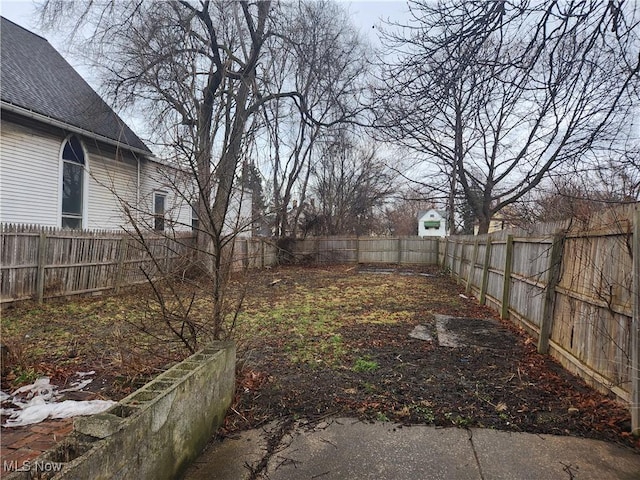 view of yard with a fenced backyard