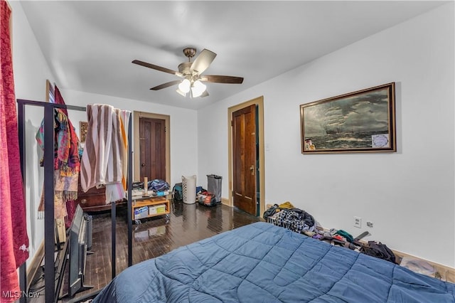 bedroom featuring ceiling fan and wood finished floors