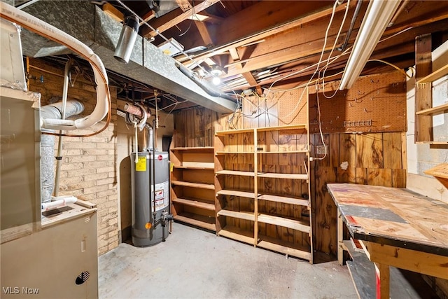 unfinished basement featuring water heater