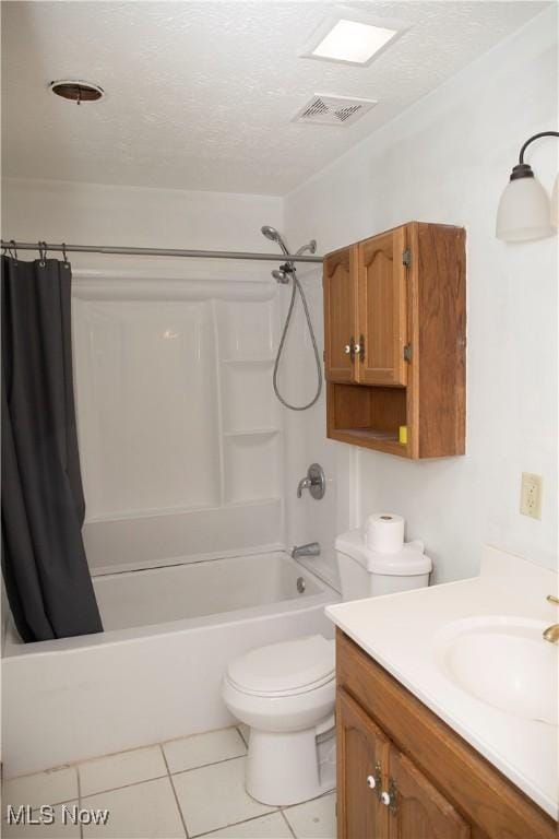 full bathroom with tile patterned flooring, shower / bath combination with curtain, visible vents, toilet, and a textured ceiling