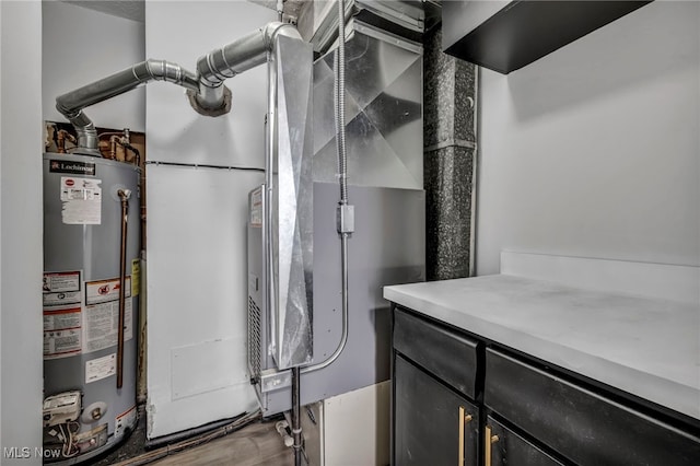 utility room featuring gas water heater