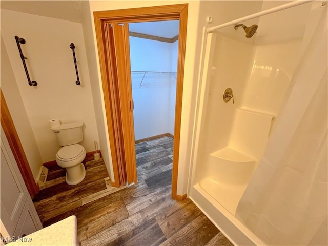 50055 Carroll Rd, East Liverpool, OH 43920 - full bath with toilet, wood finished floors, a stall shower, and baseboards