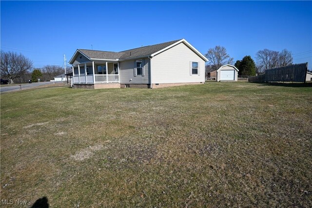 50055 Carroll Rd, East Liverpool, OH 43920 - exterior space featuring a porch, a yard, an outdoor structure, crawl space, and a garage