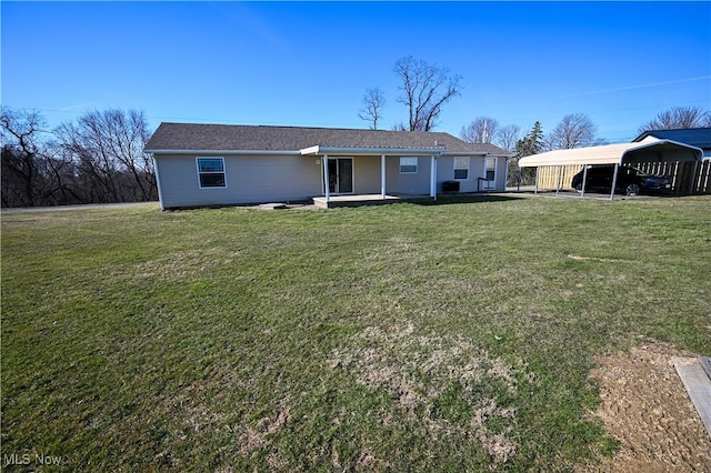 50055 Carroll Rd, East Liverpool, OH 43920 - rear view of house featuring a detached carport and a lawn