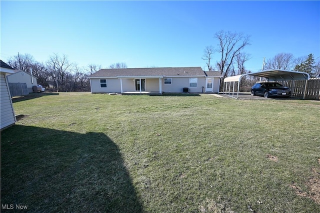 50055 Carroll Rd, East Liverpool, OH 43920 - back of house featuring a detached carport and a yard