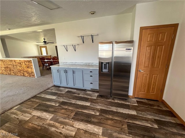 50055 Carroll Rd, East Liverpool, OH 43920 - kitchen with a ceiling fan, dark wood-type flooring, stainless steel refrigerator with ice dispenser, and a textured ceiling