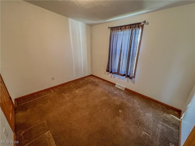 50055 Carroll Rd, East Liverpool, OH 43920 - unfurnished room with visible vents, carpet flooring, a textured ceiling, and baseboards
