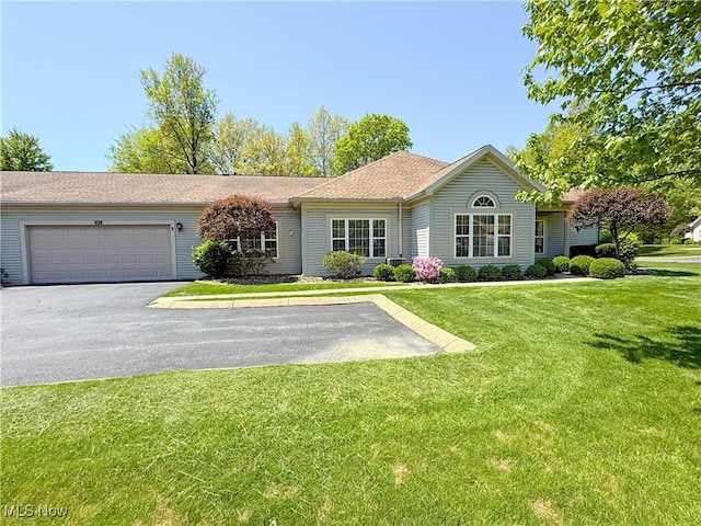 20 Hunters Woods Blvd Unit A, Canfield, OH 44406 - ranch-style house with a front lawn, an attached garage, and asphalt driveway