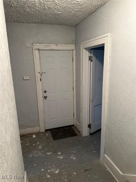 174 Colony Cres, Akron, OH 44305 - doorway to outside with a textured wall