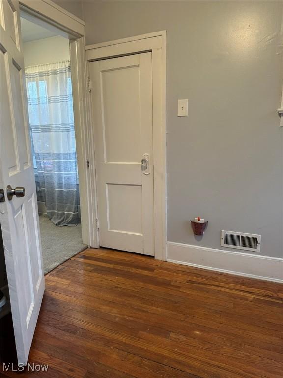 174 Colony Cres, Akron, OH 44305 - hallway featuring wood-type flooring and baseboards