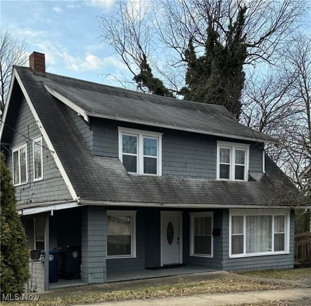 174 Colony Cres, Akron, OH 44305 - view of front of property with covered porch, a chimney, and roof with shingles