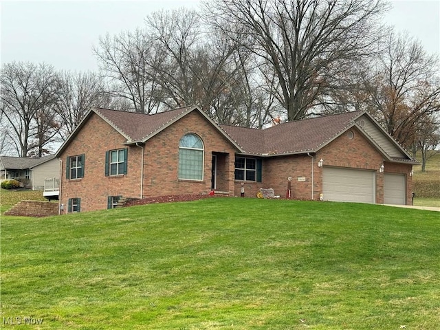31 Briar Ln, Millersburg, OH 44654 - ranch-style home featuring an attached garage, brick siding, and a front yard