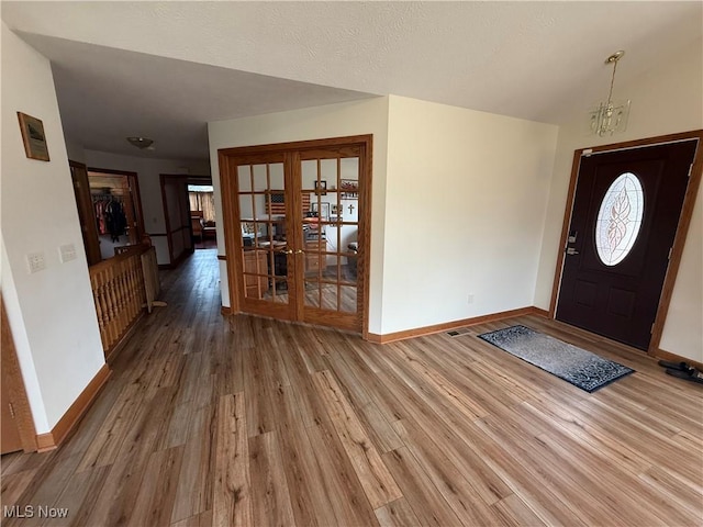 31 Briar Ln, Millersburg, OH 44654 - foyer entrance with wood finished floors, baseboards, and french doors